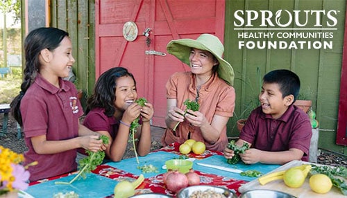 20984-Culture_Foundation-img-2 Sprouts Foundation logo next to teacher with students