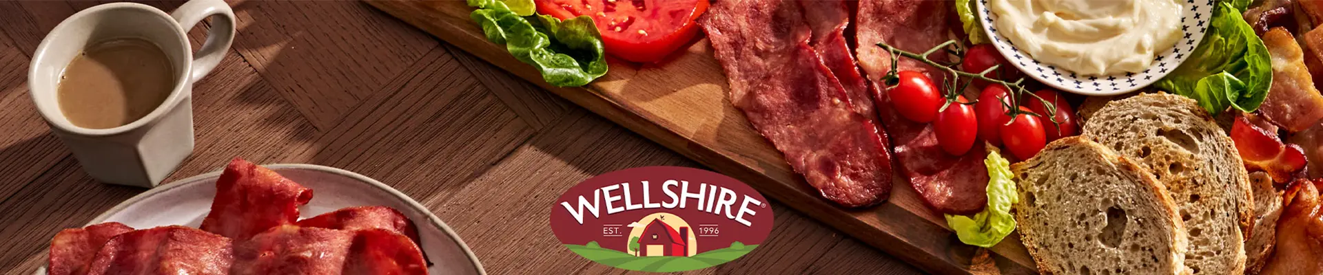 Wellshire logo in front of bacon on a serving plate